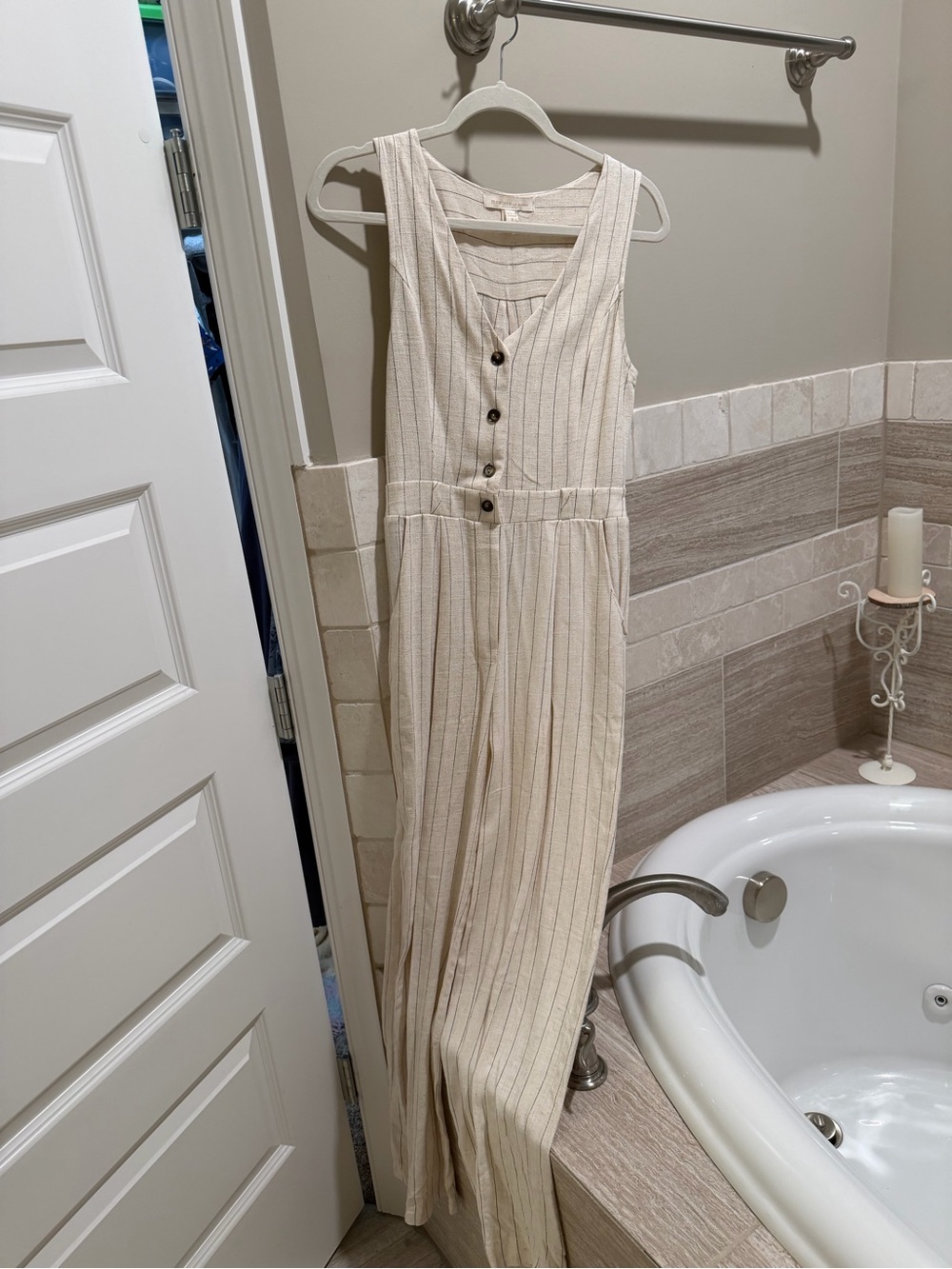 Sleeveless Cream Striped Jumpsuit with Button Front